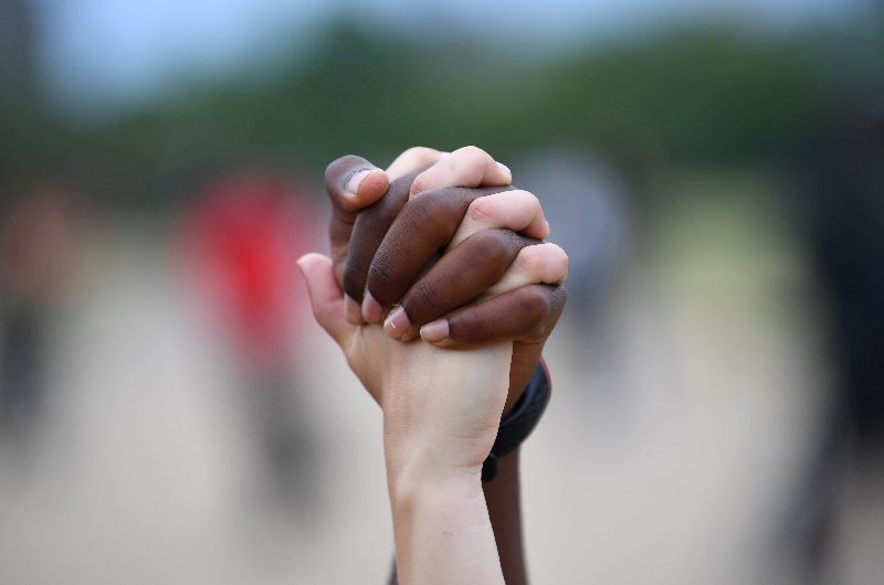 A man and a woman hold hands aloft in Hyde Park during a Black Lives Matter protest following the death of George Floyd who died in police custody in Minneapolis, London, Britain, June 3, 2020. (Photo by Dylan Martinez/Reuters)